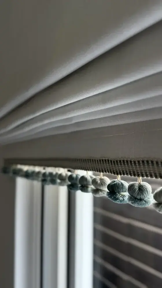 Pleated sheer with pom-pom trim