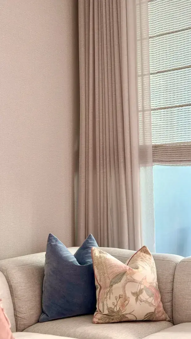 Living room with cushions and drapery