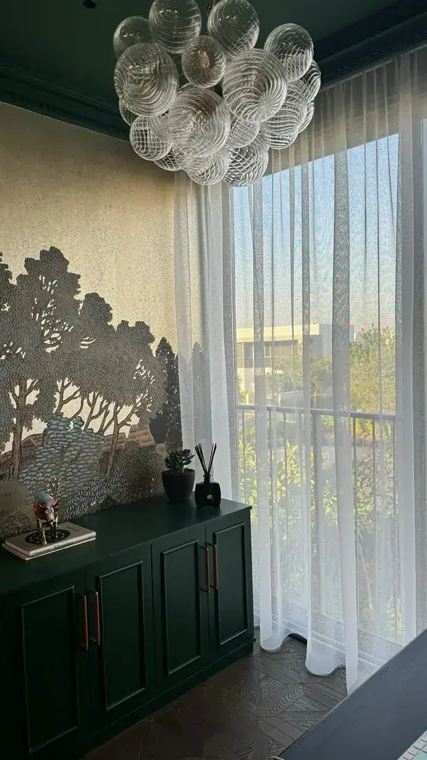 Emerald study with patterned wall and sheers